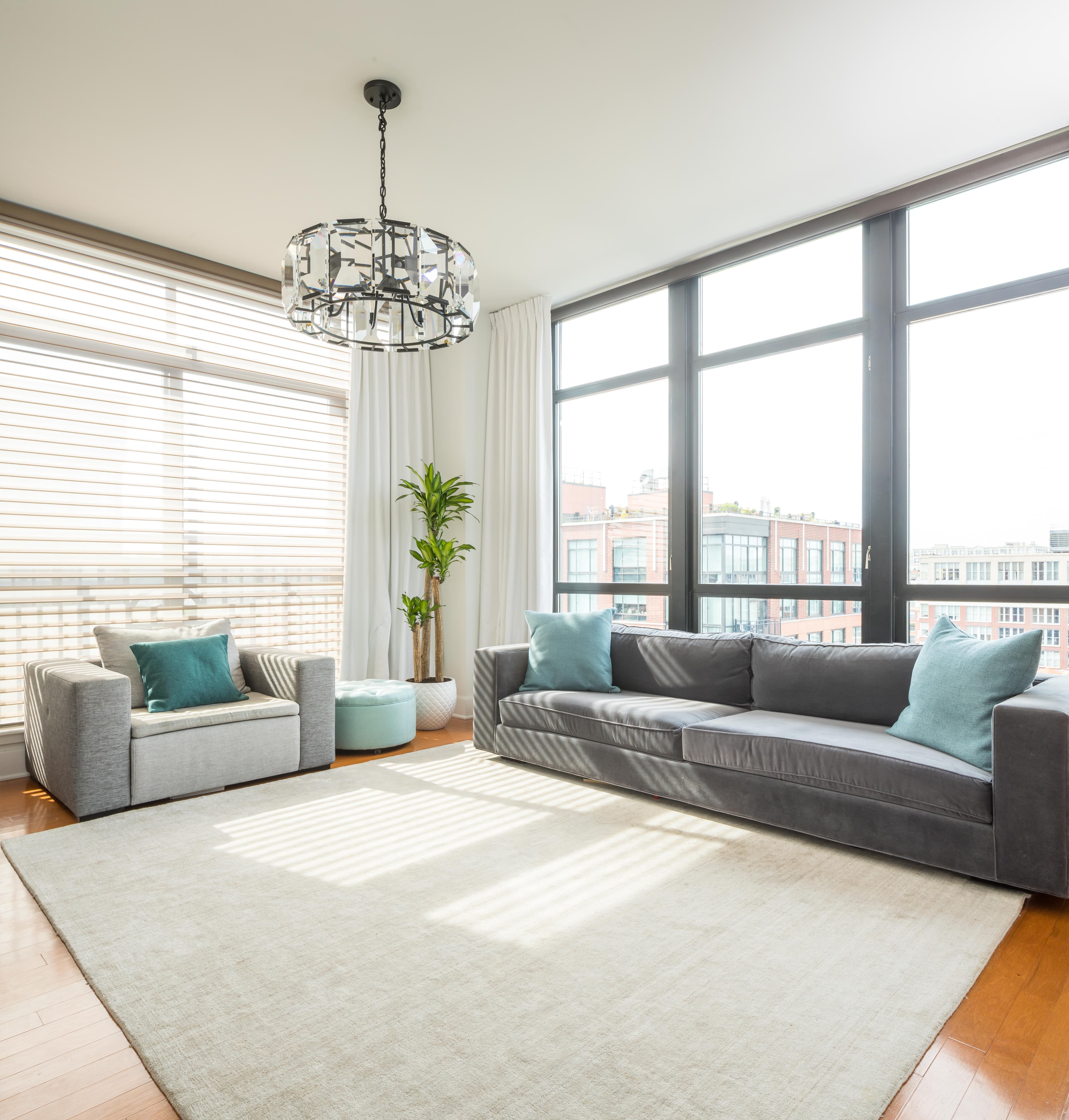 Staged living room with a grey sofa
