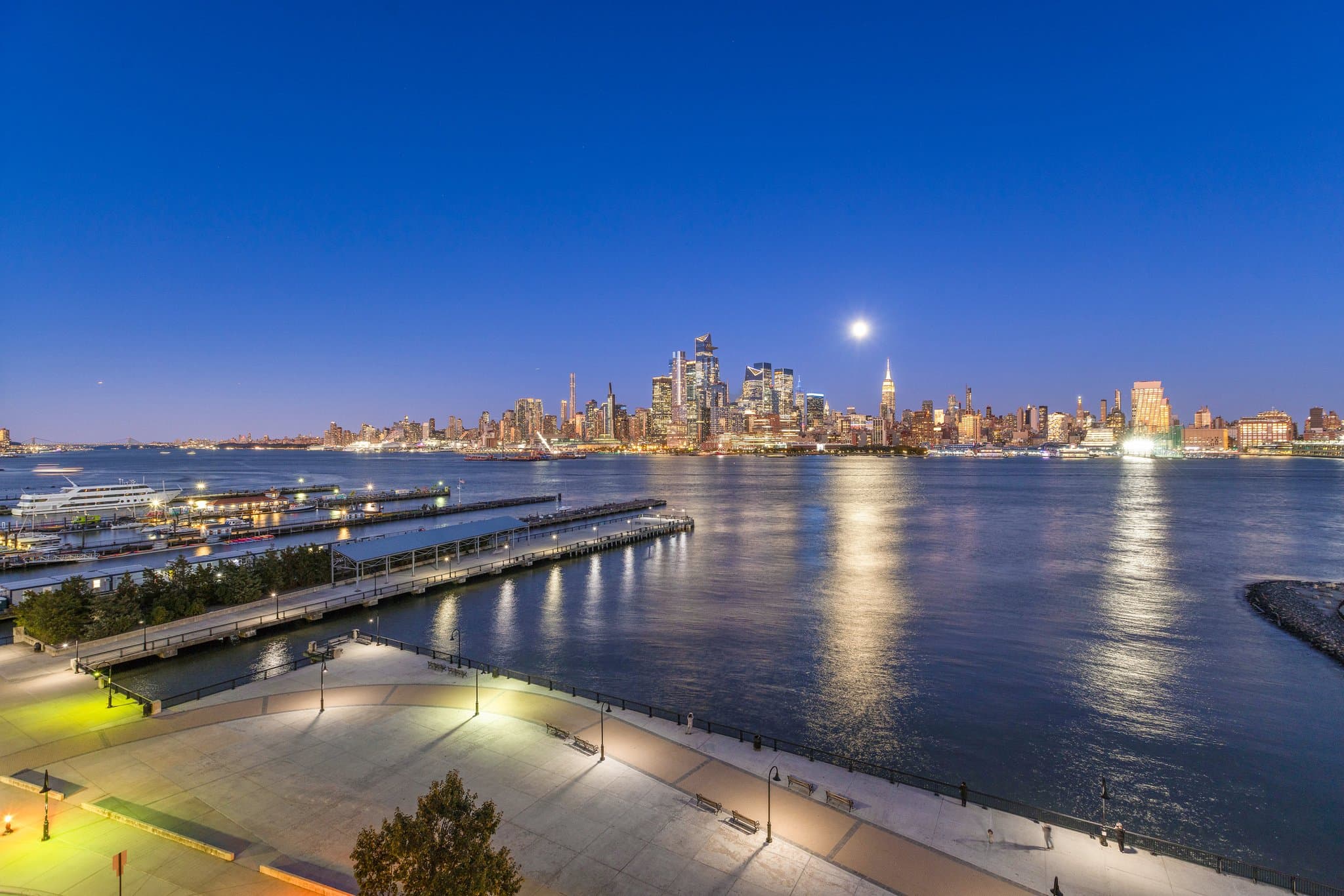 The Midtown skyline at dusk across the Hudson, from the Hoboken promenade